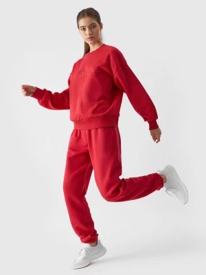Zdjęcie produktu Spodnie dresowe joggery damskie - czerwone 4F
