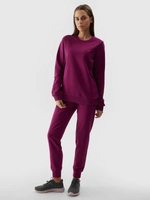 Zdjęcie produktu Spodnie dresowe joggery damskie - fioletowe 4F