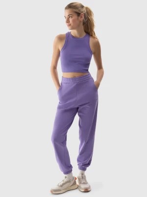 Zdjęcie produktu Spodnie dresowe joggery damskie - fioletowe 4F
