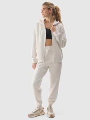 Zdjęcie produktu Spodnie dresowe joggery damskie - kremowe 4F
