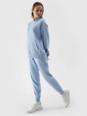 Zdjęcie produktu Spodnie dresowe joggery damskie - niebieskie 4F