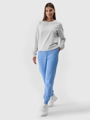Zdjęcie produktu Spodnie dresowe joggery damskie - niebieskie 4F