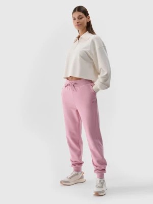 Zdjęcie produktu Spodnie dresowe joggery damskie - pudrowy róż 4F