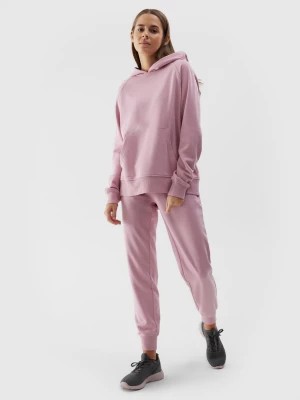 Zdjęcie produktu Spodnie dresowe joggery damskie - różowe 4F