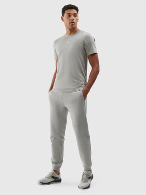 Zdjęcie produktu Spodnie dresowe joggery z bawełny organicznej męskie - szare 4F