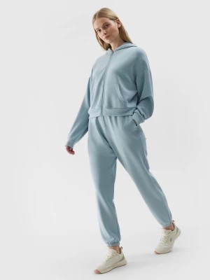Zdjęcie produktu Spodnie dresowe joggery z dodatkiem modalu damskie - jasny niebieski 4F