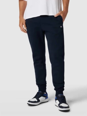 Zdjęcie produktu Spodnie dresowe o kroju regular fit z elastycznym pasem Champion