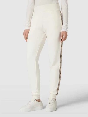 Zdjęcie produktu Spodnie dresowe o kroju regular fit z lampasami model ‘BRITNEY’ Guess Activewear