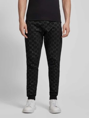 Zdjęcie produktu Spodnie dresowe o kroju regular fit z nadrukiem z logo na całej powierzchni Karl Lagerfeld