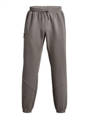 Zdjęcie produktu Under Armour Spodnie dresowe w kolorze taupe rozmiar: XXL