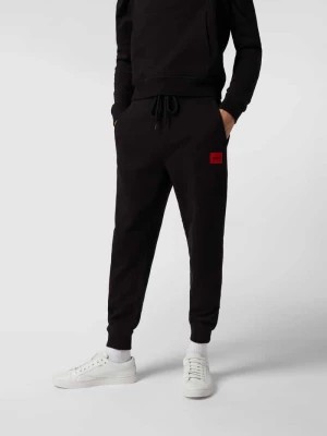 Zdjęcie produktu Spodnie dresowe z bawełny model ‘Doak212’ HUGO
