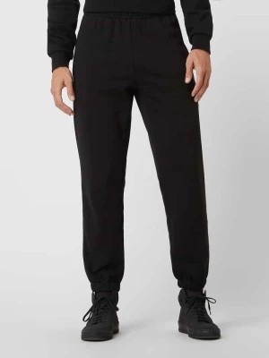 Zdjęcie produktu Spodnie dresowe z detalem z logo Lacoste