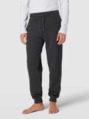 Zdjęcie produktu Spodnie dresowe z paskami w kontrastowym kolorze model ‘ESTABLISHED’ Tommy Hilfiger