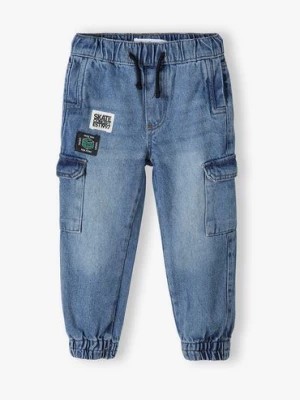 Zdjęcie produktu Spodnie jeansowe dla niemowlaka z naszywkami Minoti