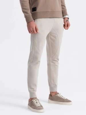 Zdjęcie produktu Spodnie męskie dresowe typu jogger - jasnobeżowe V1 OM-PABS-0173
 -                                    L