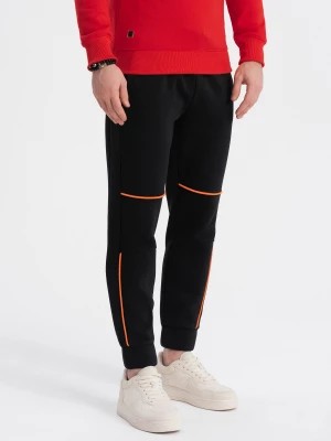 Zdjęcie produktu Spodnie męskie dresowe z kontrastowymi przeszyciami - czarne V1 OM-PASK-0145
 -                                    S
