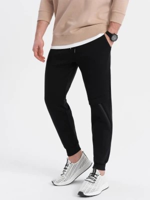 Zdjęcie produktu Spodnie męskie dresowe z przeszyciem i zamkiem na nogawce - czarne V1 OM-PASK-0147
 -                                    S