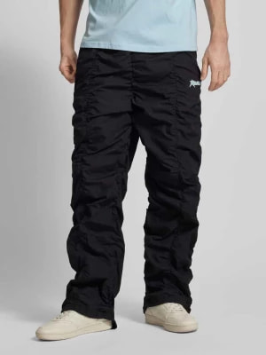 Zdjęcie produktu Spodnie o kroju baggy fit z marszczeniami REVIEW
