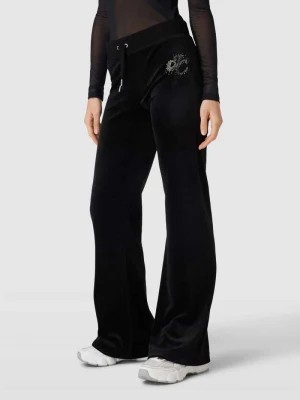 Zdjęcie produktu Spodnie typu track pants o rozkloszowanym kroju model ‘SCATTER DIAMANTE’ Juicy Couture