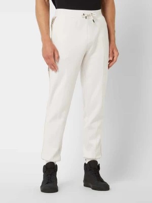 Zdjęcie produktu Spodnie z dzianiny dresowej z paskami z logo Guess Activewear
