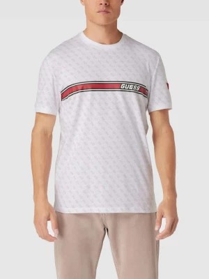 Zdjęcie produktu T-shirt z logo na całej powierzchni model ‘JAMEY’ Guess Activewear