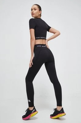 Zdjęcie produktu The North Face legginsy sportowe damskie kolor czarny gładkie NF0A82GOJK31