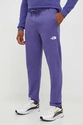 Zdjęcie produktu The North Face spodnie dresowe bawełniane kolor fioletowy gładkie