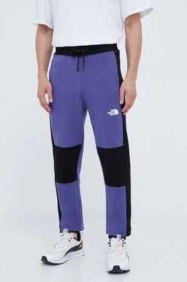 Zdjęcie produktu The North Face spodnie dresowe bawełniane kolor fioletowy wzorzyste