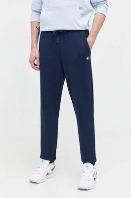 Zdjęcie produktu Tommy Jeans spodnie dresowe bawełniane kolor granatowy gładkie DM0DM18355