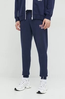 Zdjęcie produktu Tommy Jeans spodnie dresowe kolor granatowy z aplikacją