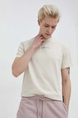 Zdjęcie produktu Tommy Jeans t-shirt bawełniany męski kolor beżowy z aplikacją DM0DM18266