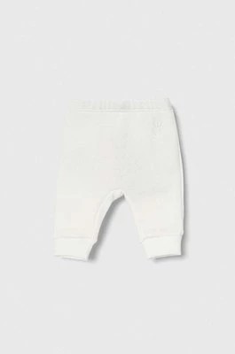 Zdjęcie produktu United Colors of Benetton spodnie dresowe bawełniane niemowlęce kolor biały melanżowe