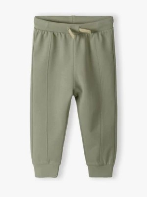 Zdjęcie produktu Zielone bawełniane spodnie dresowe dla niemowlaka - 5.10.15.