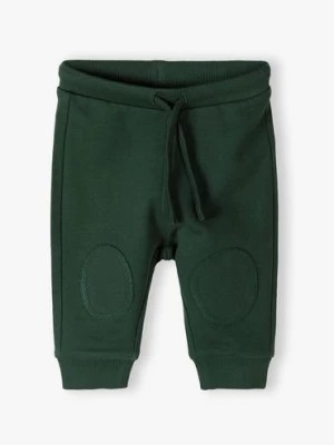 Zdjęcie produktu Zielone bawełniane spodnie dresowe niemowlęce - 5.10.15.
