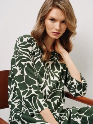 Zdjęcie produktu Zielono-biała sukienka z falbanami OCHNIK