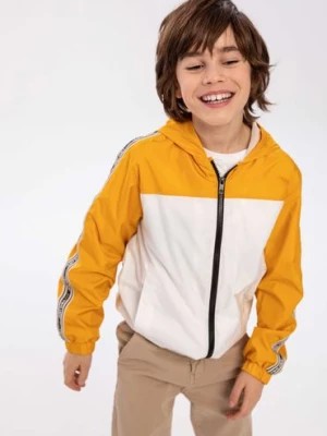 Zdjęcie produktu Żółta kurtka typu wiatrówka dla chłopca z kapturem Minoti