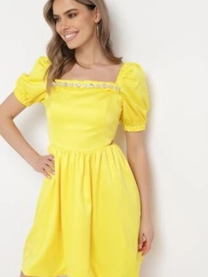 Zdjęcie produktu Żółta Sukienka Mini Rozkloszowana z Dekoltem Ozdobionym Cyrkoniami i Wycięciami po Bokach Delphira