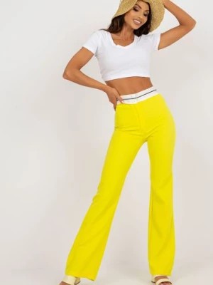Zdjęcie produktu Żółte garniturowe spodnie z materiału w kant Italy Moda