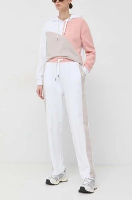 Zdjęcie produktu Armani Exchange spodnie dresowe bawełniane kolor biały z nadrukiem