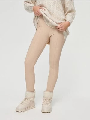 Zdjęcie produktu Beżowe legginsy z zapiętkami House