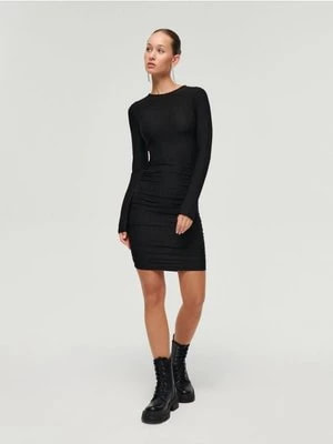 Zdjęcie produktu Błyszcząca sukienka mini czarna House