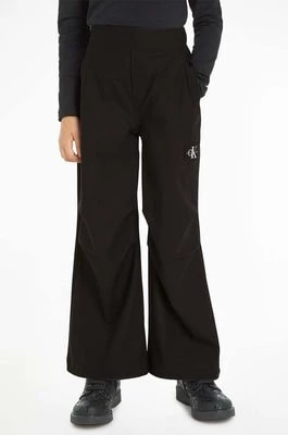 Zdjęcie produktu Calvin Klein Jeans spodnie dziecięce kolor czarny gładkie