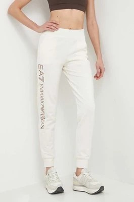 Zdjęcie produktu EA7 Emporio Armani spodnie dresowe kolor beżowy z nadrukiem