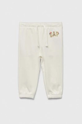 Zdjęcie produktu GAP spodnie dresowe dziecięce kolor biały z aplikacją