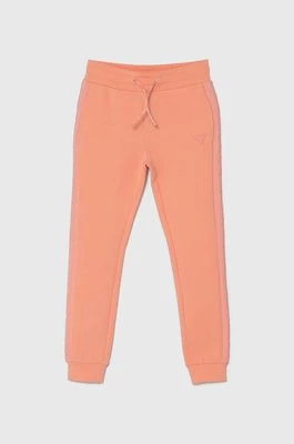 Zdjęcie produktu Guess spodnie dresowe dziecięce kolor pomarańczowy gładkie