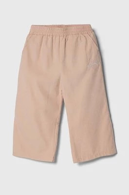 Zdjęcie produktu Guess spodnie dziecięce kolor różowy gładkie