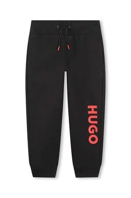 Zdjęcie produktu HUGO spodnie dresowe dziecięce kolor czarny z nadrukiem