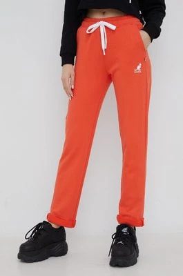 Zdjęcie produktu Kangol spodnie dresowe bawełniane damskie kolor pomarańczowy gładkie