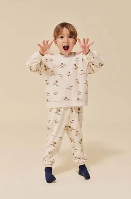 Zdjęcie produktu Konges Sløjd spodnie dresowe bawełniane dziecięce kolor beżowy z nadrukiem