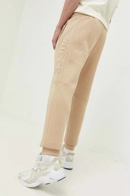 Zdjęcie produktu Nicce spodnie dresowe kolor beżowy z aplikacją